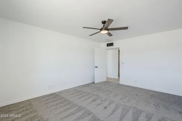 an aerial view of a house with a swimming pool and mountain view