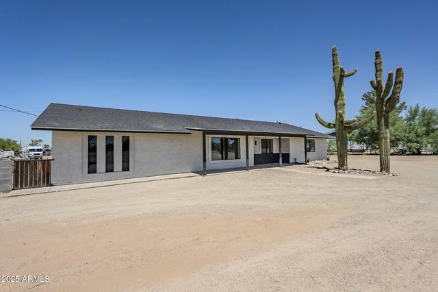 a kitchen with kitchen island a sink stove and refrigerator