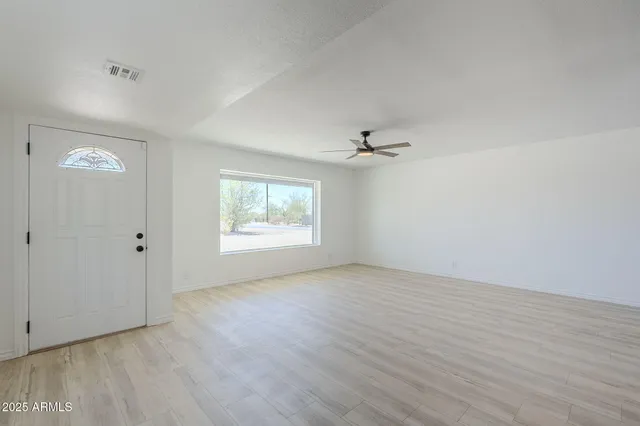 a living room with furniture a table and a fireplace