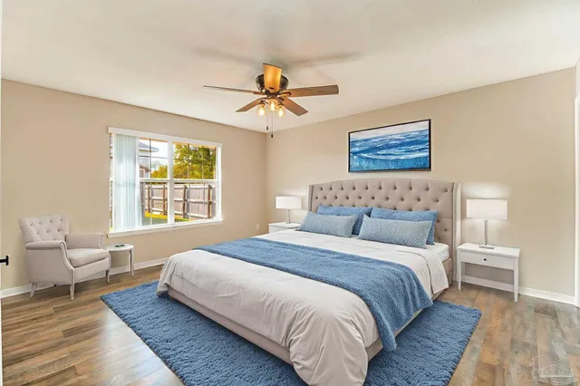 a bedroom with bed and window