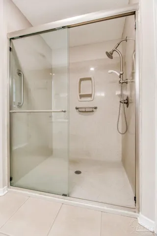 a bathroom with a glass shower door