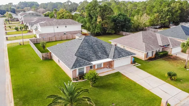 an aerial view of a house with swimming pool