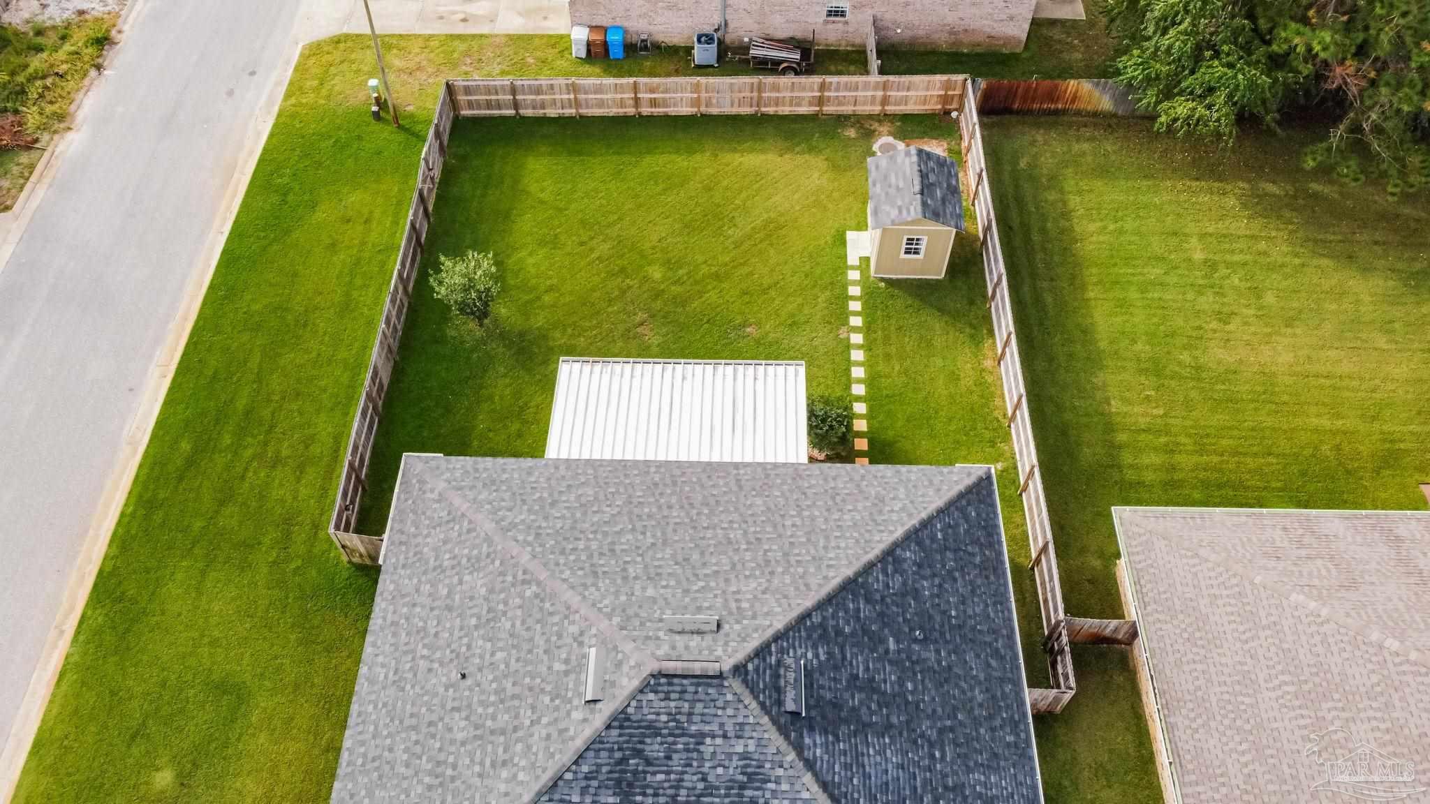 1225 Grand Ridge Circle Gulf Breeze, FL 32563 - Photo 28 of 29 an aerial view of a house with a garden and lake view