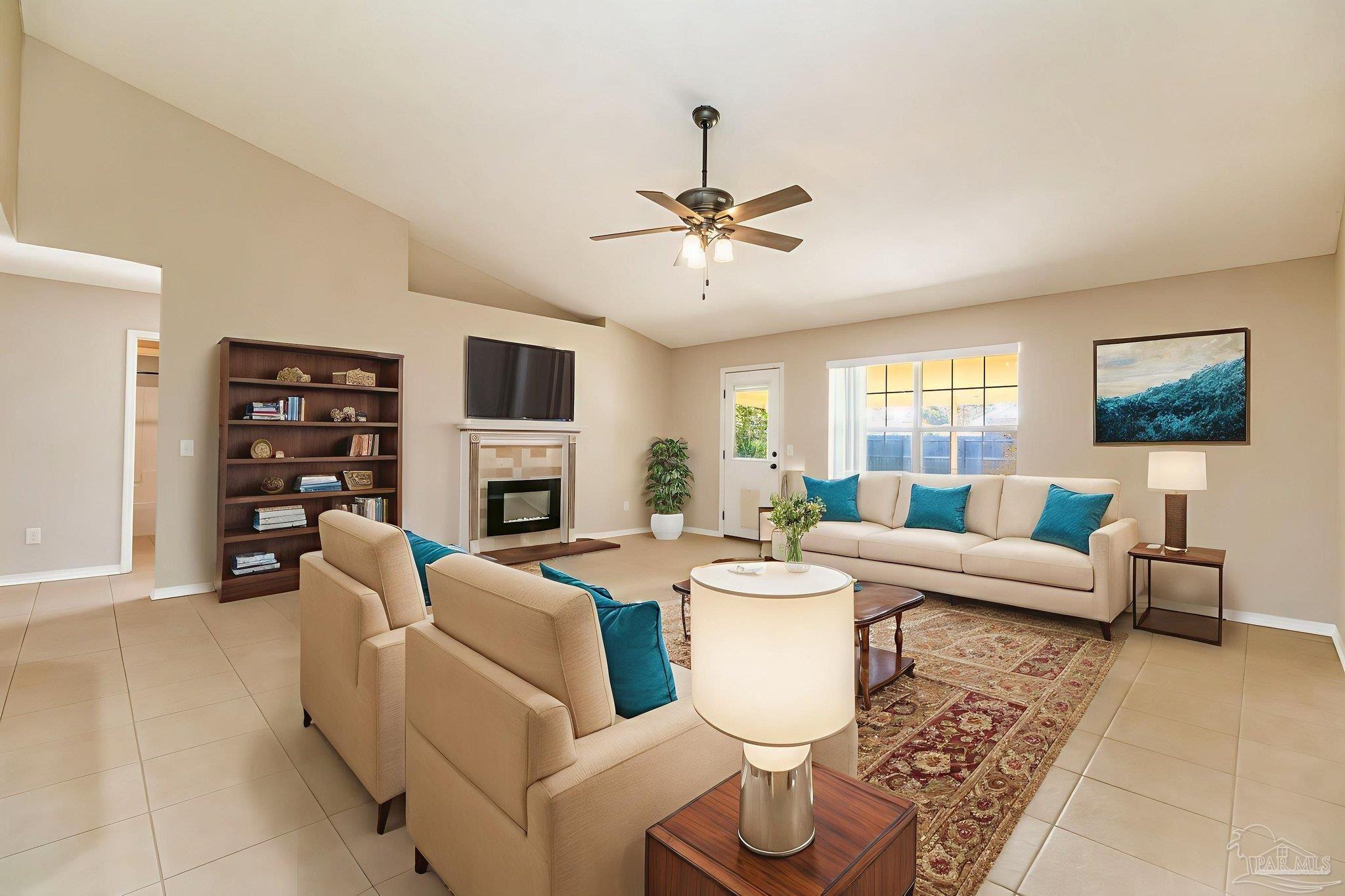 1225 Grand Ridge Circle Gulf Breeze, FL 32563 - Photo 4 of 29 a living room with fireplace furniture and a window