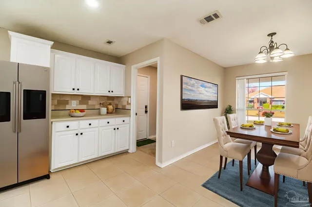 a kitchen with cabinets and window