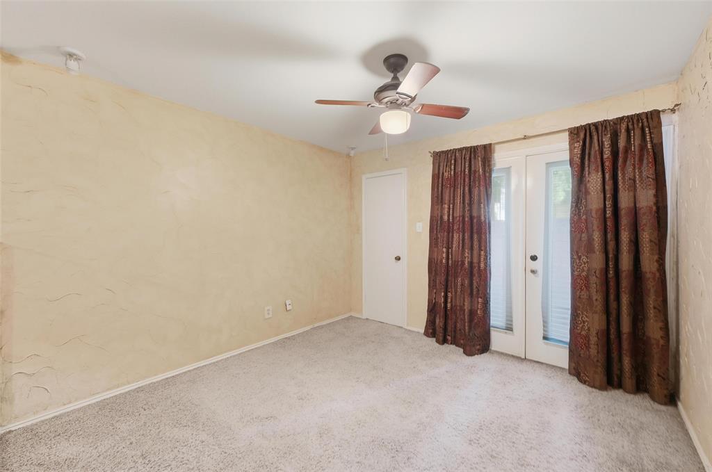 2311 Basil Drive, Unit C105 Arlington, TX 76006 - Photo 12 of 17 Unfurnished bedroom with french doors, access to outside, carpet, and a ceiling fan