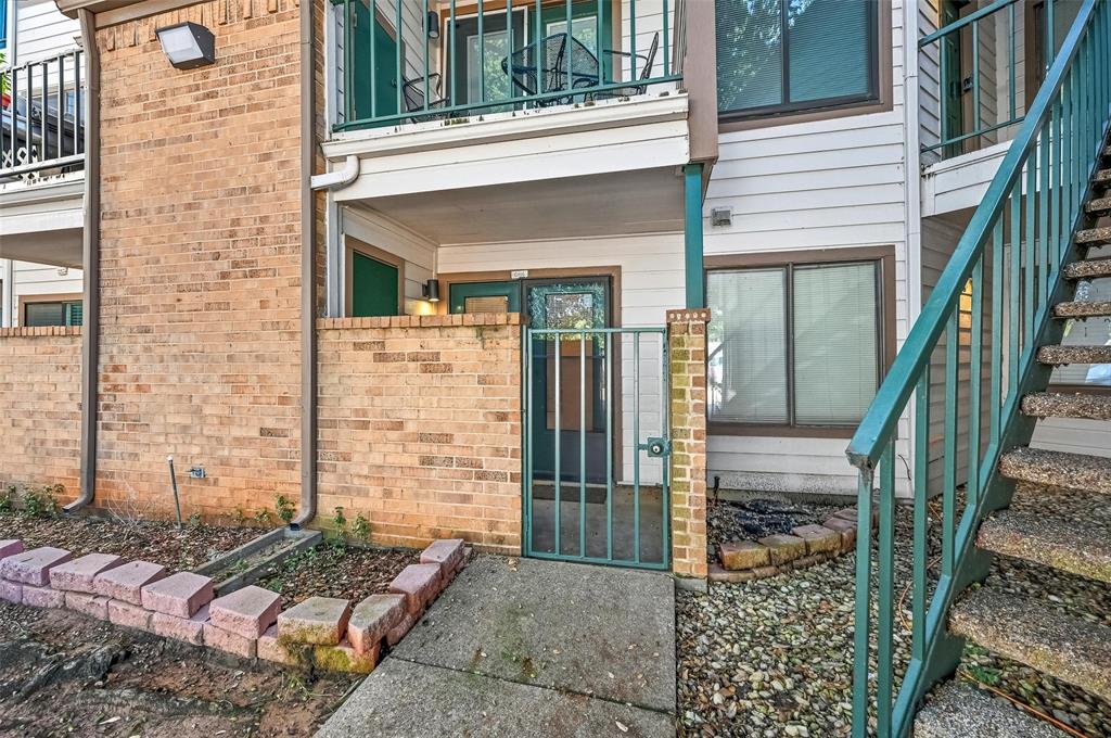 2311 Basil Drive, Unit C105 Arlington, TX 76006 - Photo 2 of 17 Doorway to property featuring brick siding