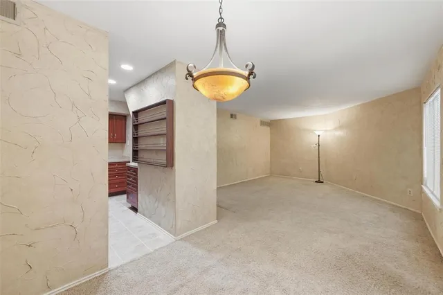 a very nice looking room with a ceiling fan