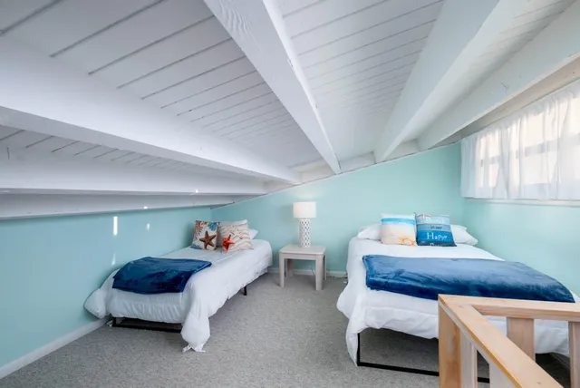 a bedroom with furniture and a chandelier