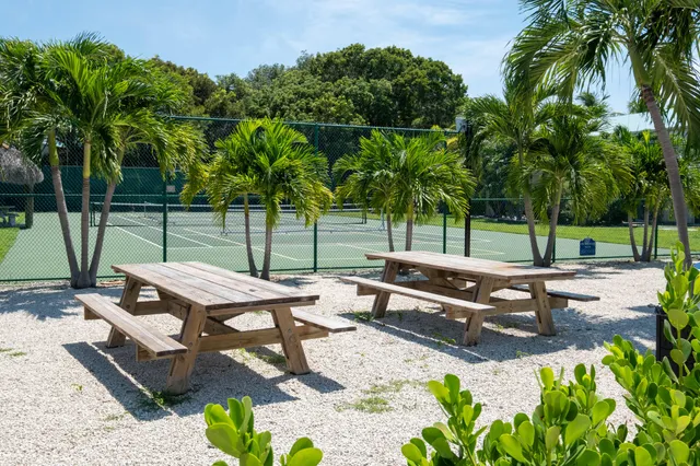 a view of a backyard with sitting area