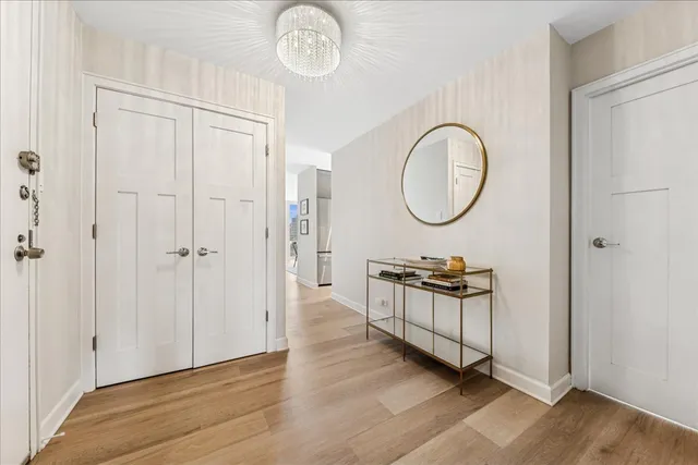 a kitchen with stainless steel appliances kitchen island granite top and refrigerator