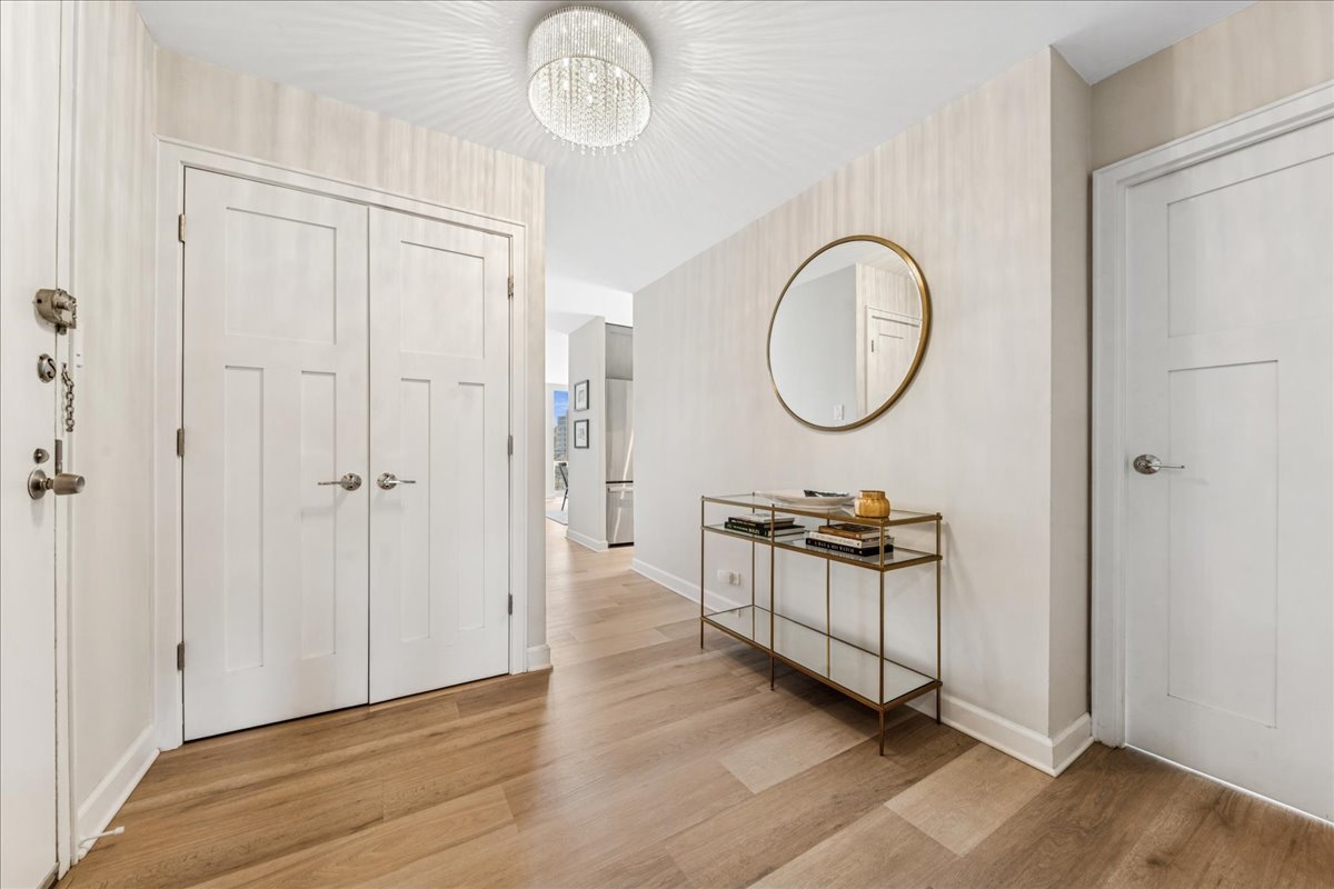 111 East Chestnut Street, Unit 22K Chicago, IL 60611 - Photo 13 of 20 a area with wooden floor and white walls