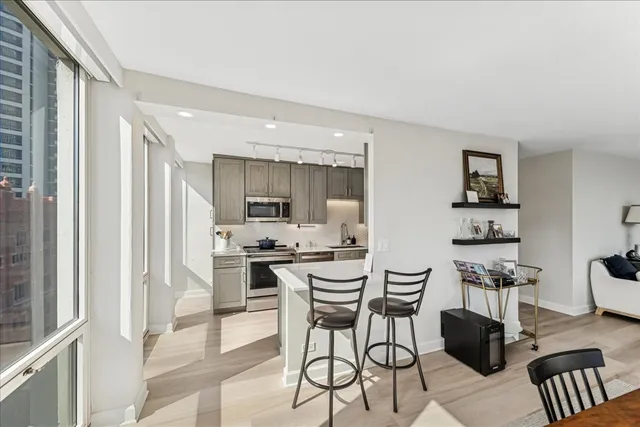 a dining room with furniture and window