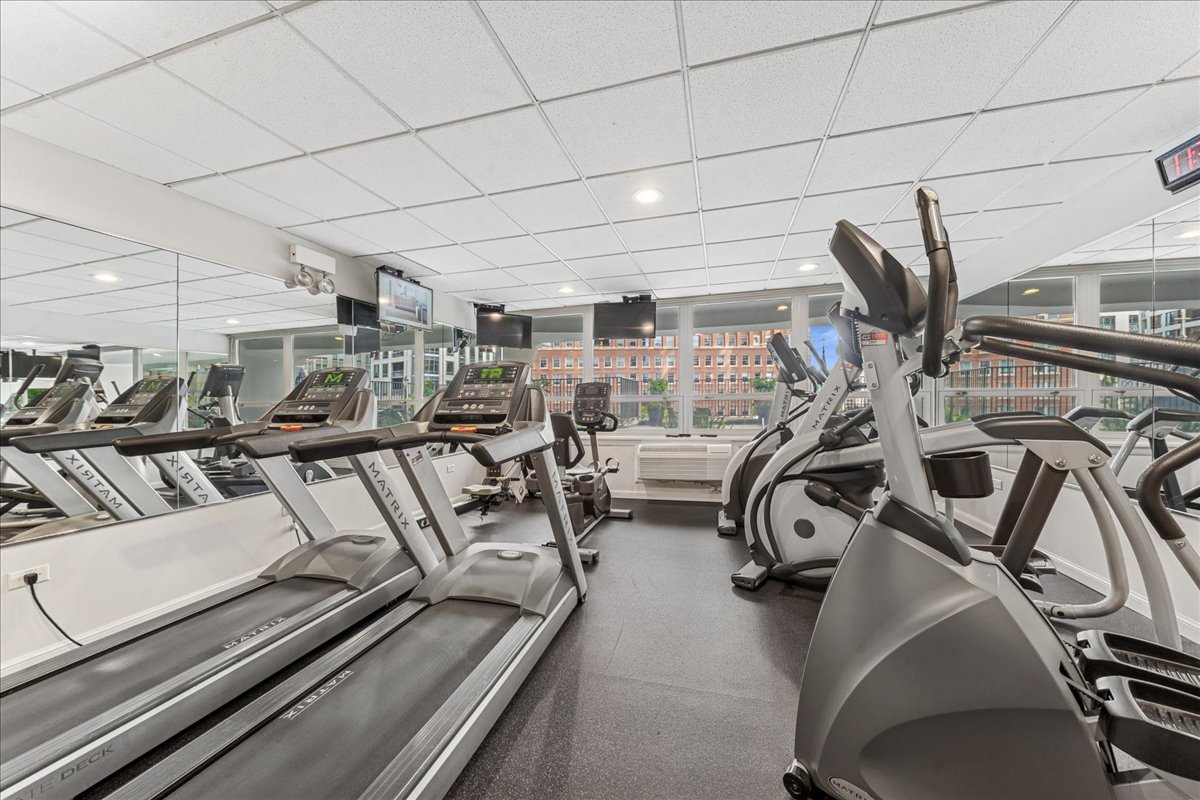 111 East Chestnut Street, Unit 22K Chicago, IL 60611 - Photo 18 of 20 a view of a room with gym equipment
