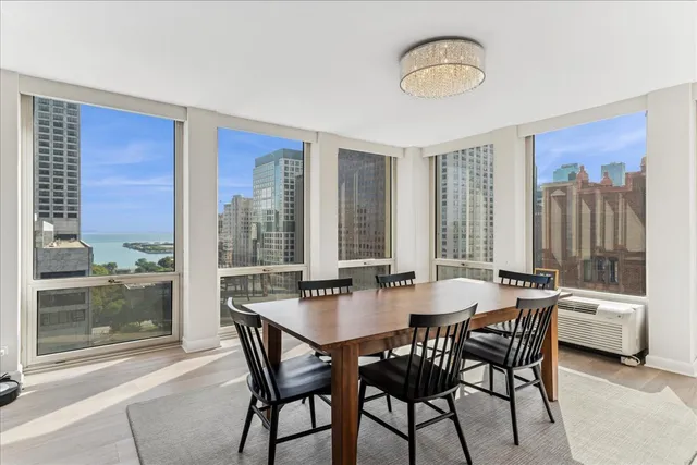 a dining room with furniture and window