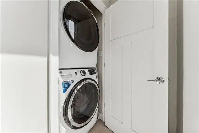 a close view of a utility room with dryer and washer