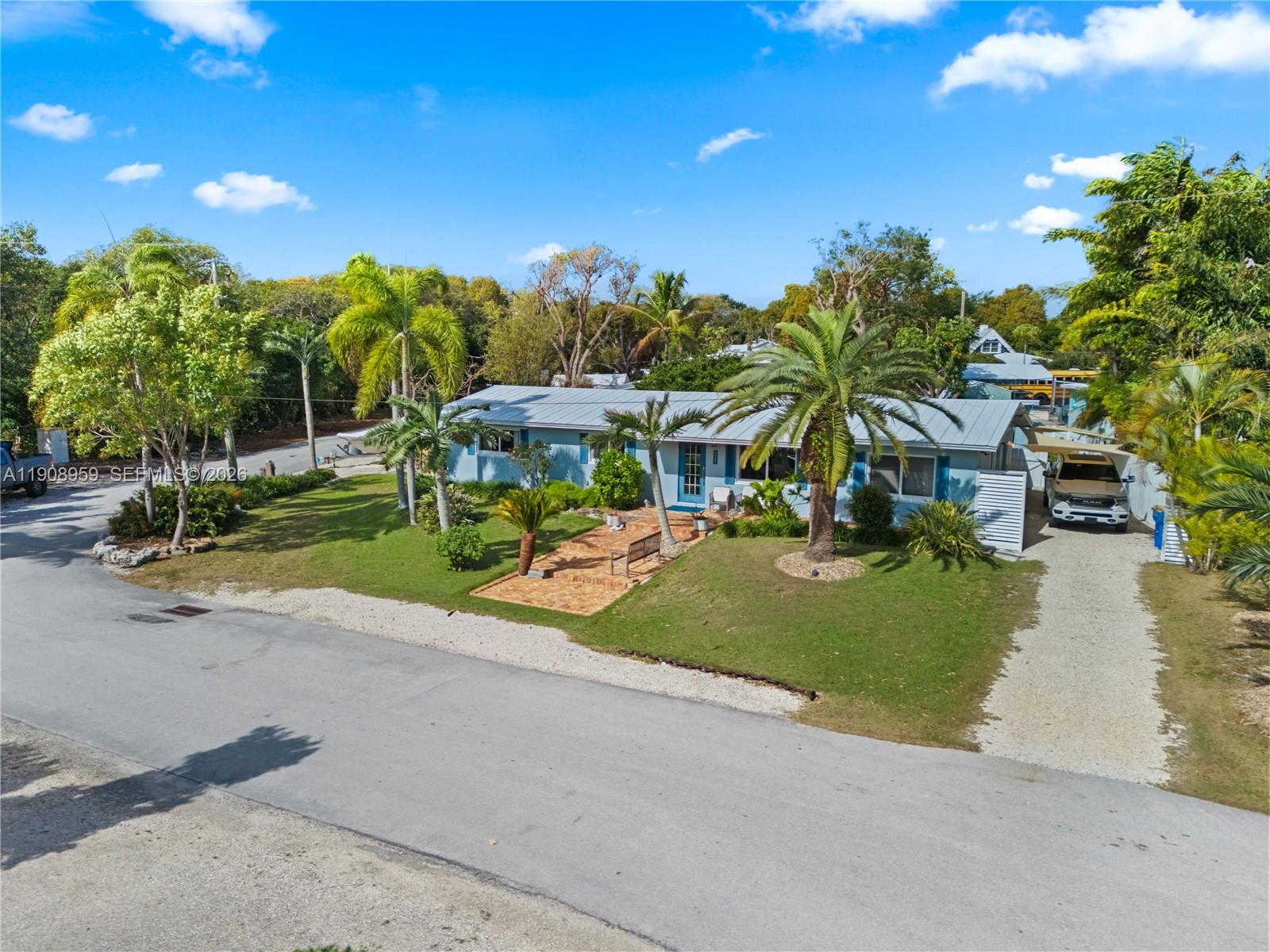 160 Ridge Street Tavernier, FL 33070 - Photo 23 of 24 a view of a street with houses on both side
