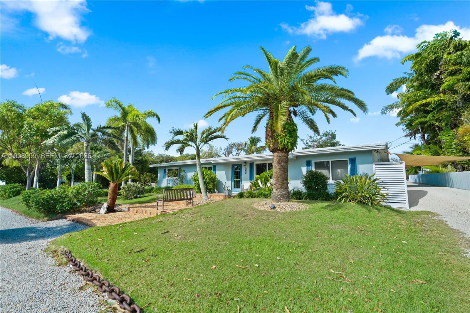 160 Ridge Street Tavernier, FL 33070 - Photo 4 of 24 a front view of house with yard and green space