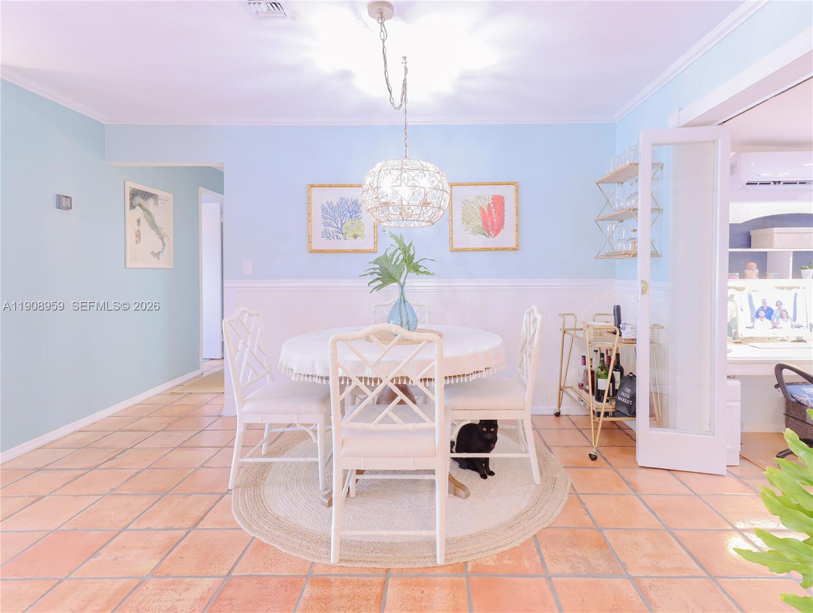 160 Ridge Street Tavernier, FL 33070 - Photo 8 of 24 a dining room with table chairs and chandelier