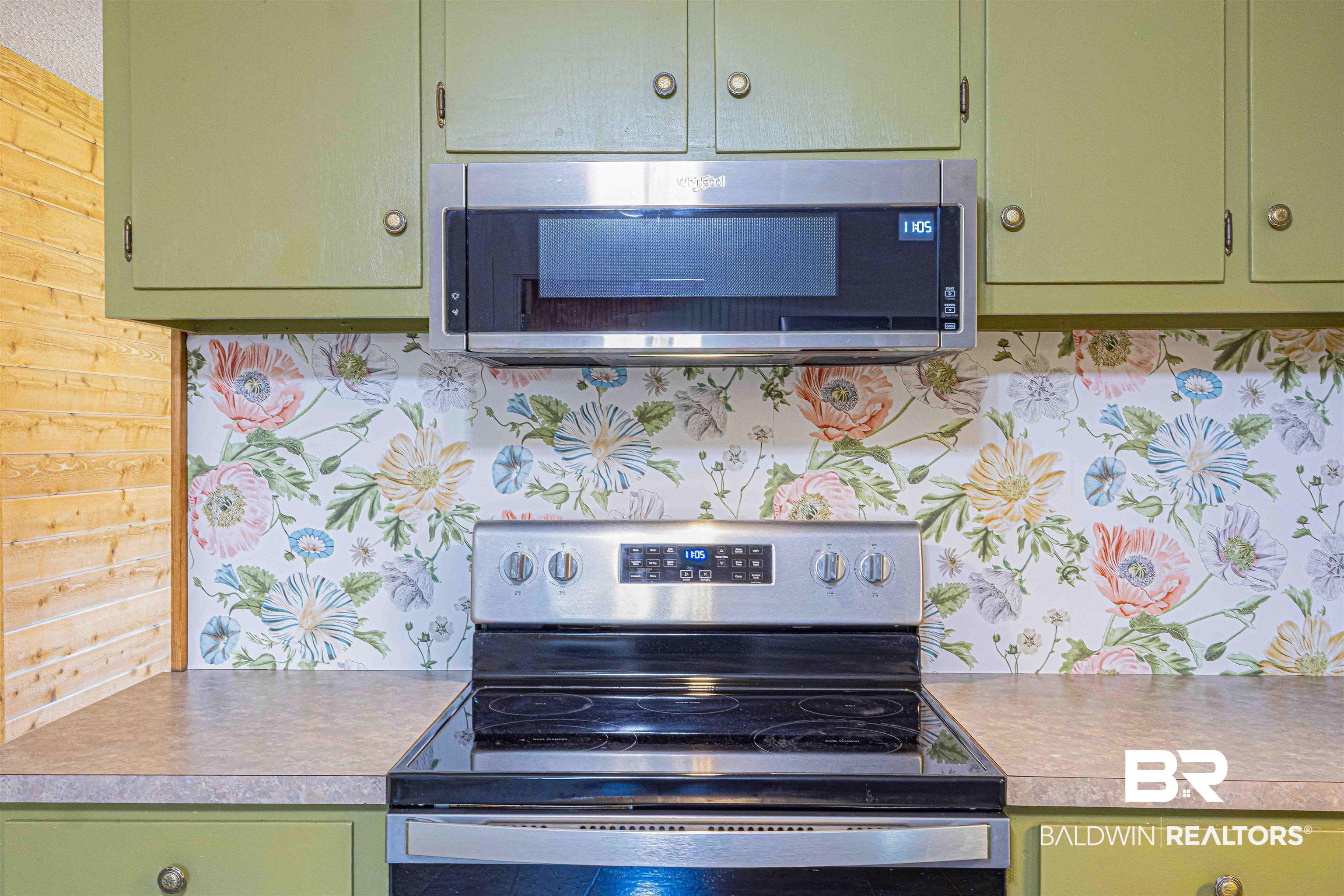 43101 Brown Road Bay Minette, AL 36507 - Photo 18 of 81 Kitchen featuring green cabinetry, stainless steel appliances, light countertops, and wallpapered walls