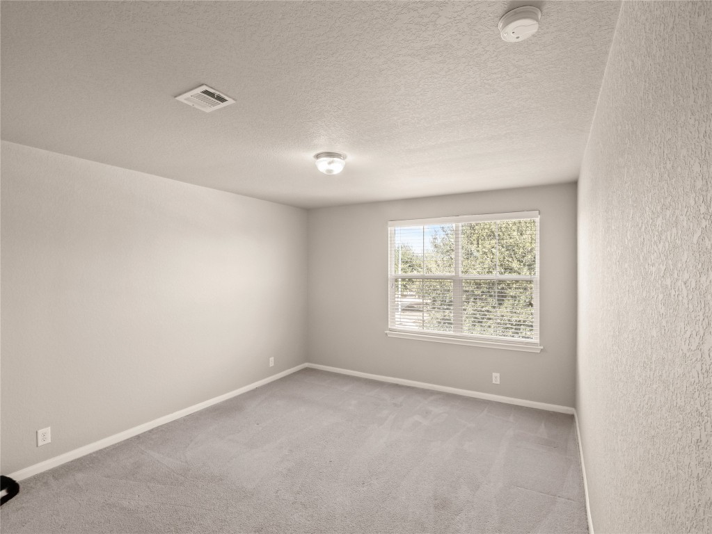 102 Wisteria Way San Marcos, TX 78666 - Photo 17 of 29 an empty room with a window