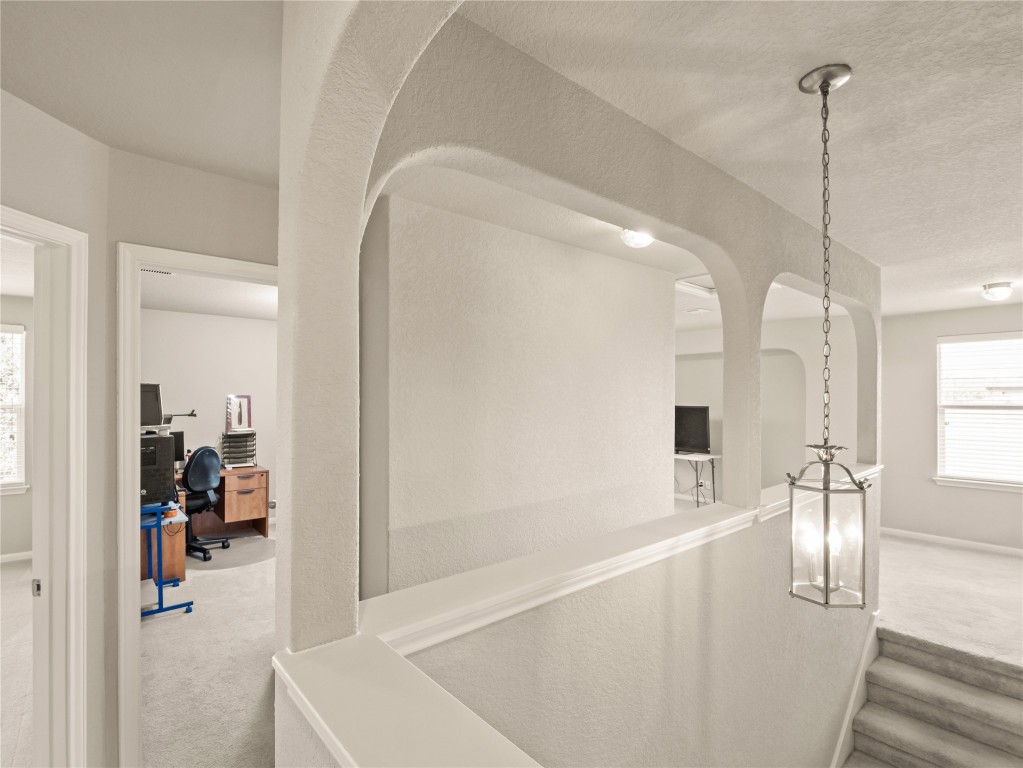 102 Wisteria Way San Marcos, TX 78666 - Photo 22 of 29 a view of a living room and a ceiling fan