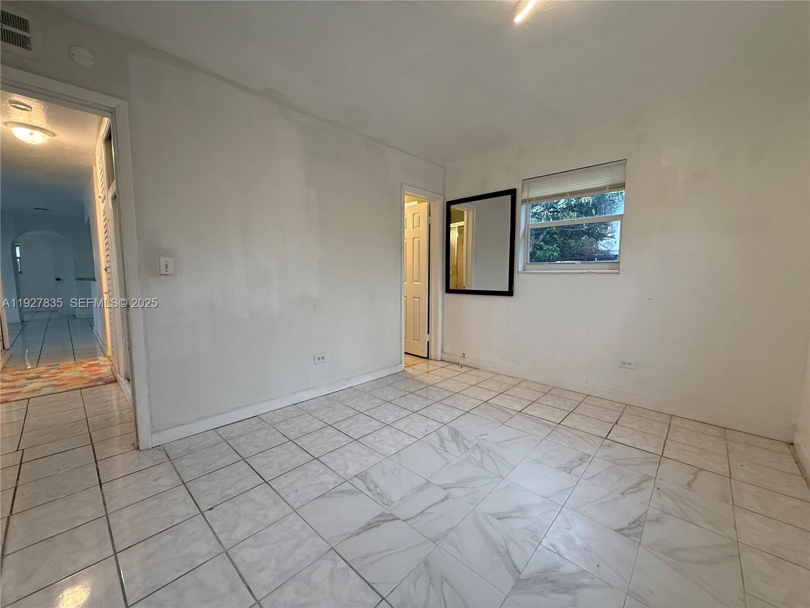 301 North 70th Avenue Hollywood, FL 33024 - Photo 11 of 14 an empty room with windows
