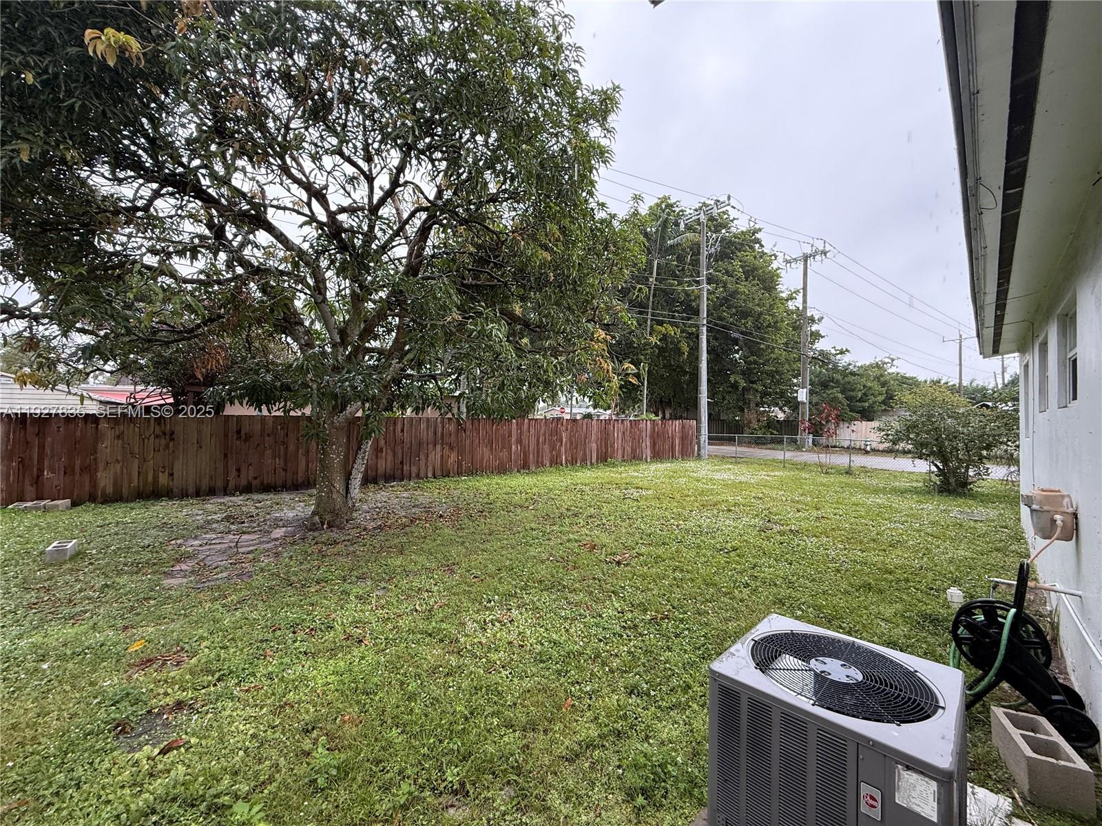 301 North 70th Avenue Hollywood, FL 33024 - Photo 13 of 14 a backyard of a house with lots of green space