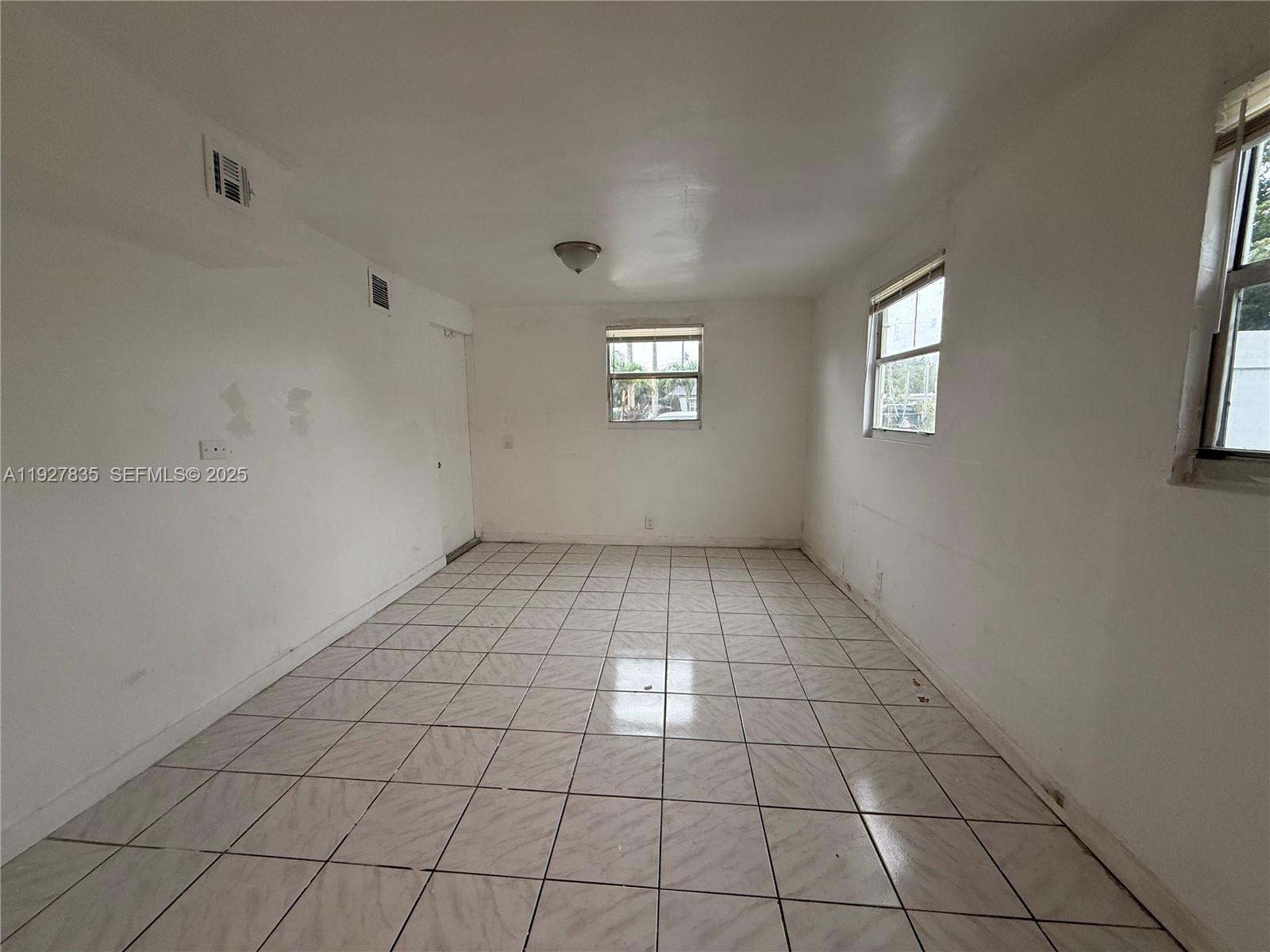 301 North 70th Avenue Hollywood, FL 33024 - Photo 6 of 14 an empty room with windows