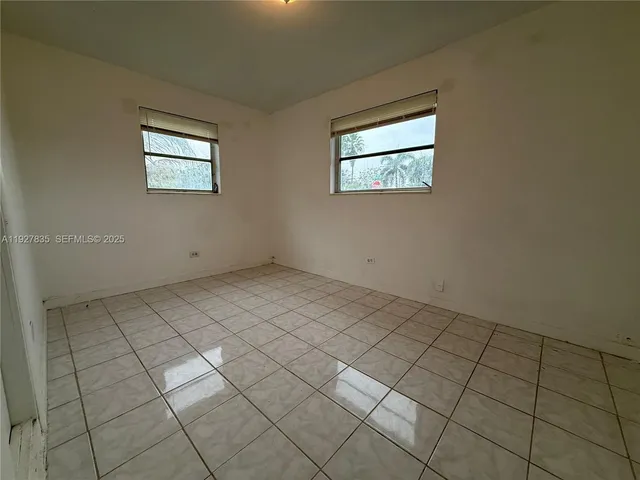 a view of a room that has a window in it