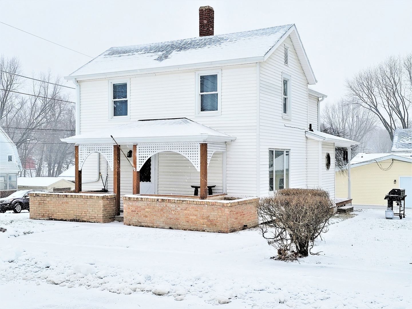 1002 Chestnut Avenue Dixon, IL 61021 - Photo 1 of 30 a view of a house with a yard and snow