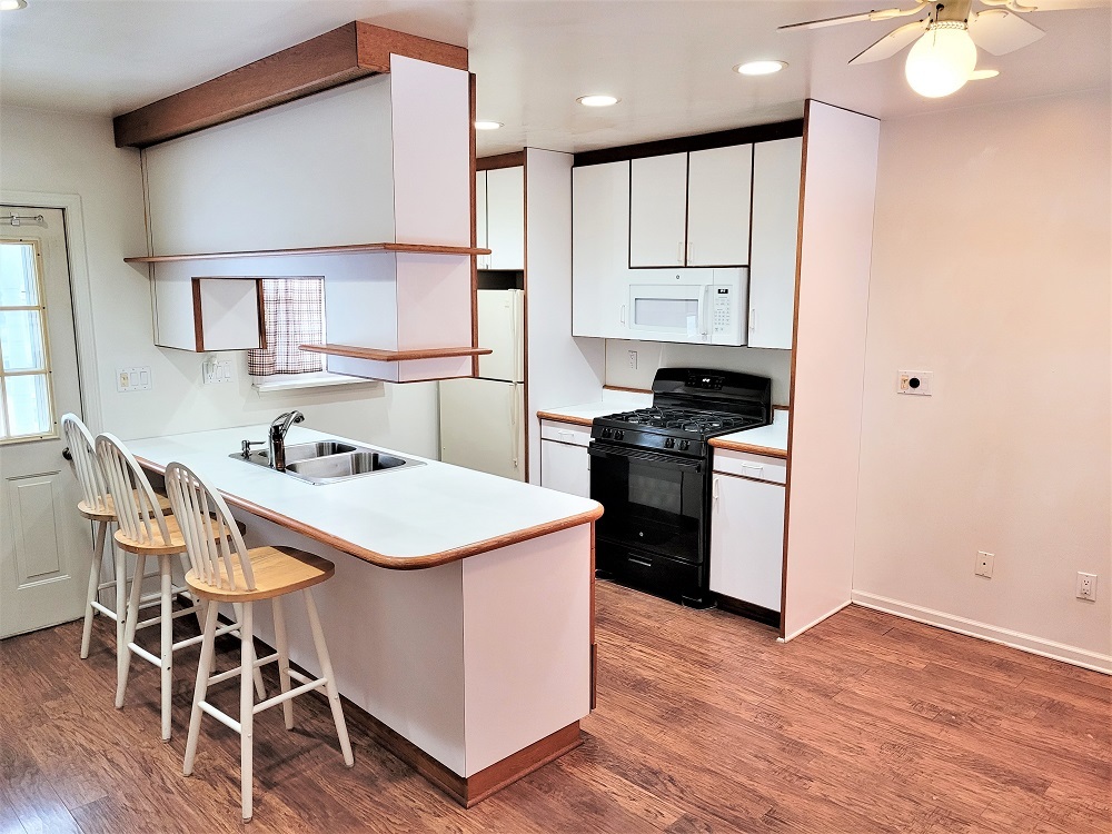 1002 Chestnut Avenue Dixon, IL 61021 - Photo 8 of 30 a kitchen with a stove a sink and a refrigerator