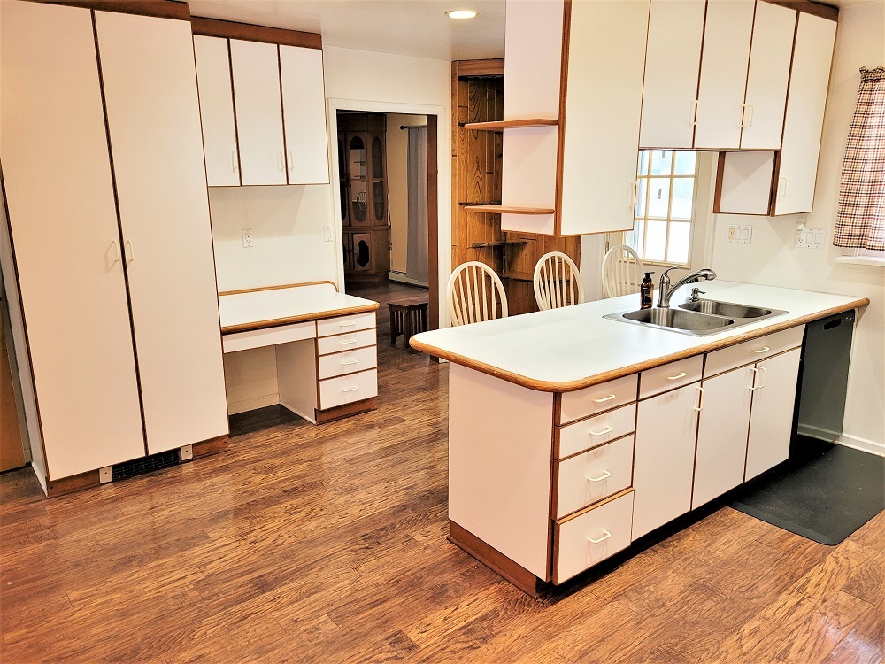 1002 Chestnut Avenue Dixon, IL 61021 - Photo 9 of 30 a kitchen with stainless steel appliances granite countertop a sink a stove a refrigerator and island with wooden floor