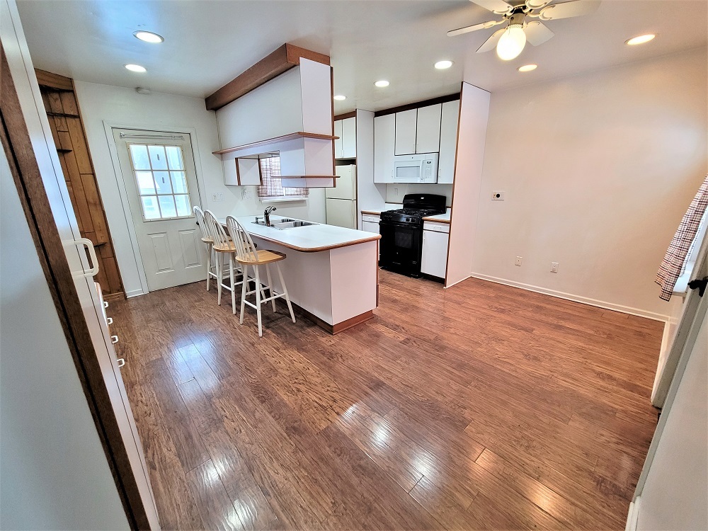 1002 Chestnut Avenue Dixon, IL 61021 - Photo 10 of 30 a kitchen with a sink a refrigerator and cabinets