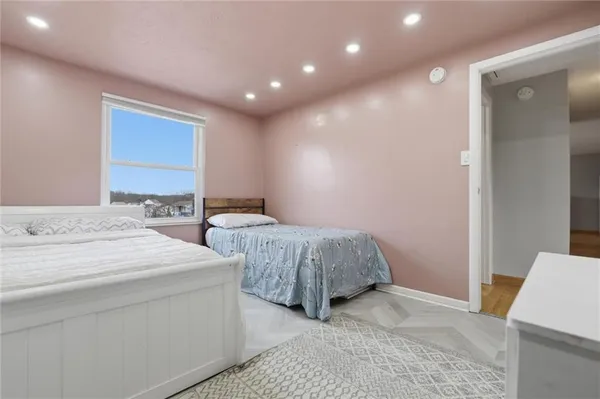 a bed room with a bed and a chair