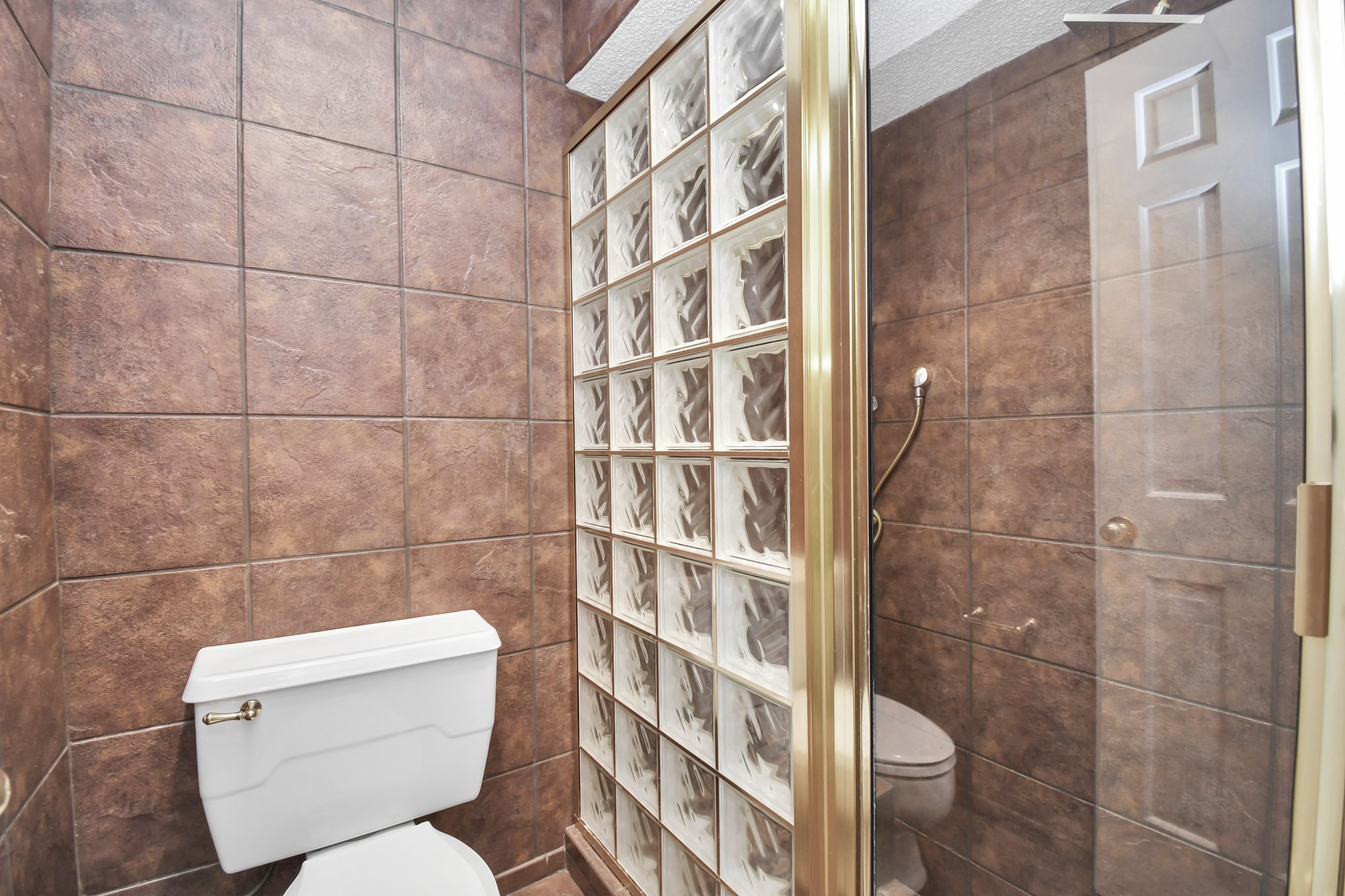 3114 Audubon Court Sugar Land, TX 77478 - Photo 16 of 29 a bathroom with a toilet and a shower