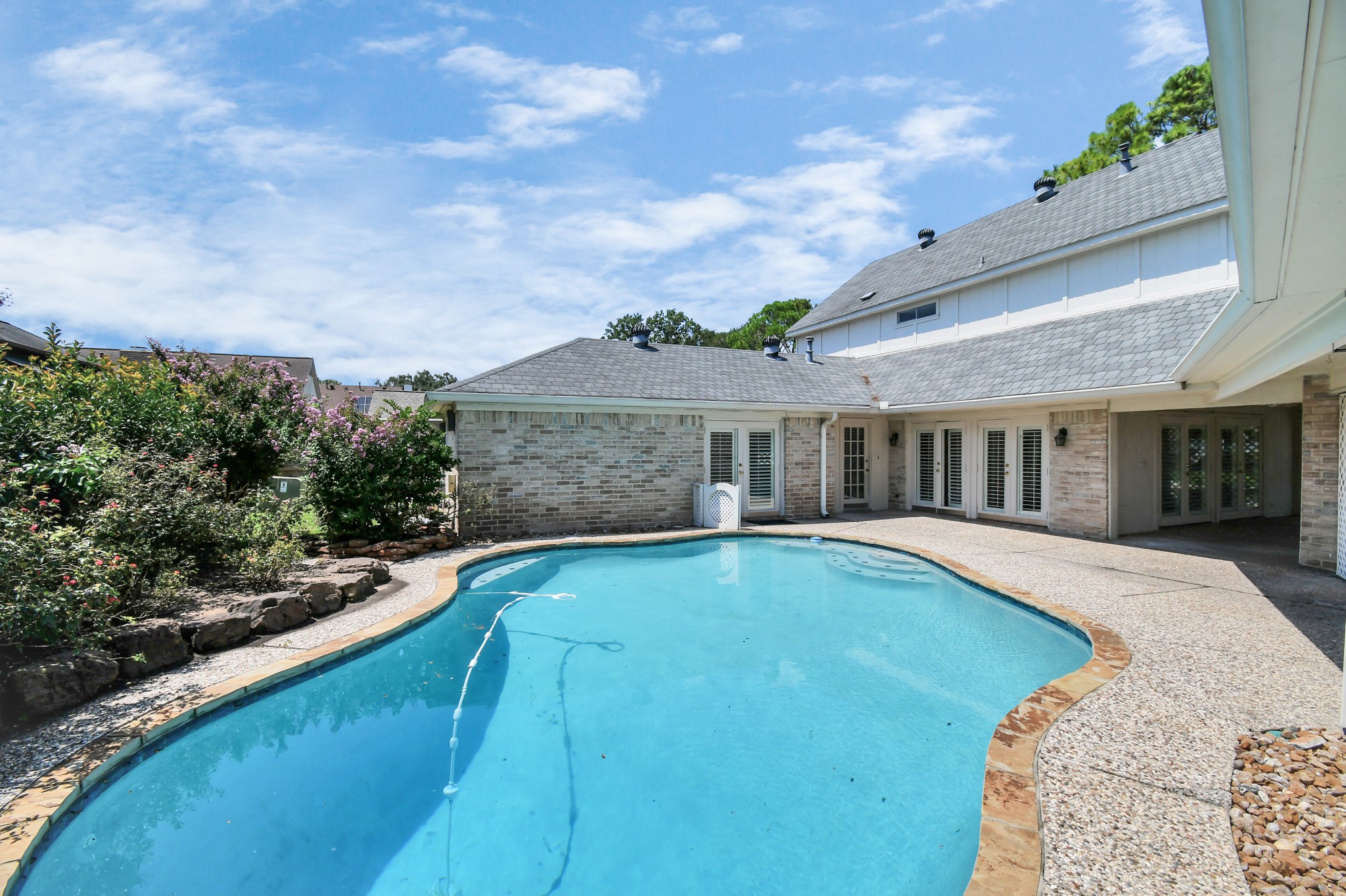 3114 Audubon Court Sugar Land, TX 77478 - Photo 25 of 29 a view of a house with pool fire pit and a chairs