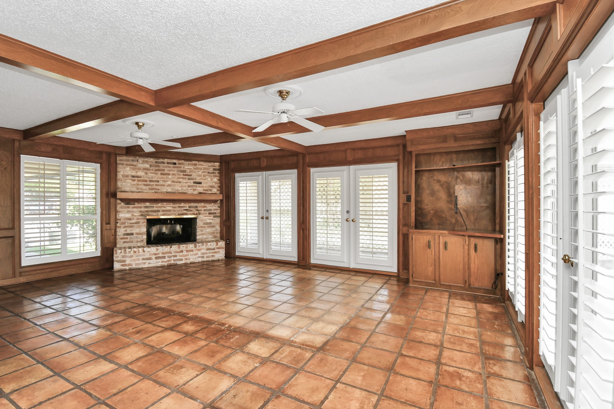 3114 Audubon Court Sugar Land, TX 77478 - Photo 7 of 29 a view of an empty room with a fireplace and a window