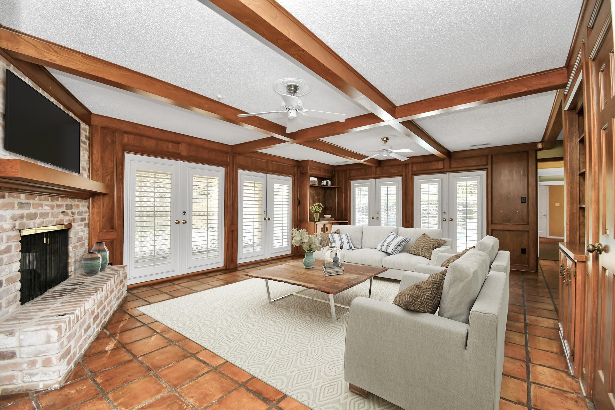 3114 Audubon Court Sugar Land, TX 77478 - Photo 8 of 29 a living room with furniture a fireplace and a floor to ceiling window