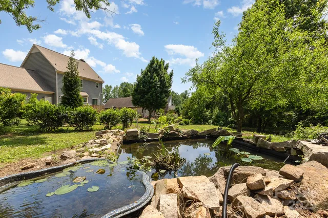 a view of a lake with a yard