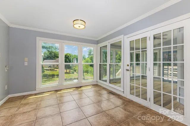 a view of an empty room with a balcony