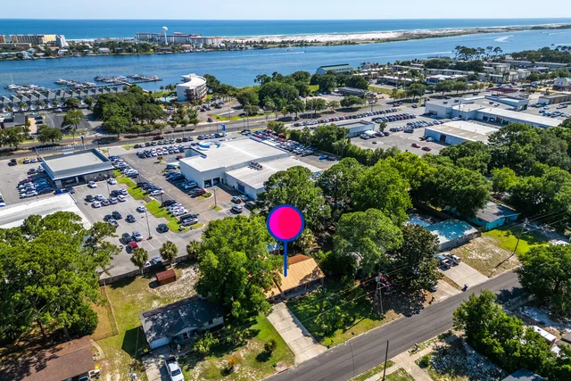 a front view of a house with yard and trees