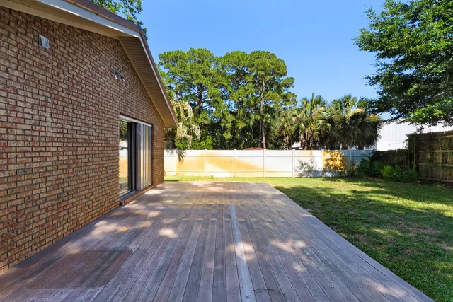 a front view of a house with a yard and porch