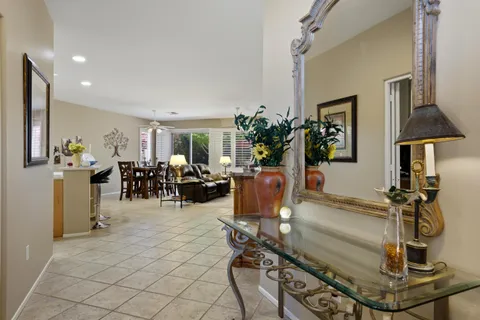 a view of a livingroom with furniture and a window