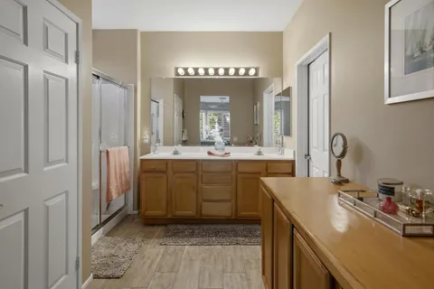 a bathroom with a sink vanity and a mirror
