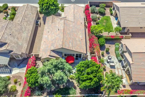 a picture of flowers outside the house