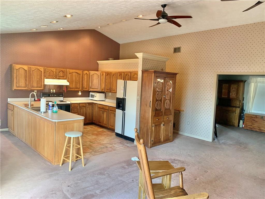 1257 Amity Ridge Road Amity, PA 15311 - Photo 3 of 21 a kitchen with a refrigerator a sink and dishwasher