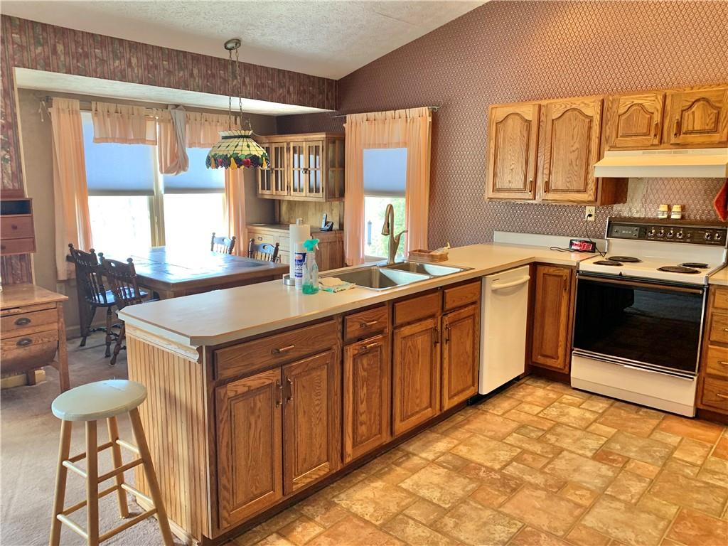 1257 Amity Ridge Road Amity, PA 15311 - Photo 4 of 21 a kitchen with stainless steel appliances a stove a sink and a refrigerator