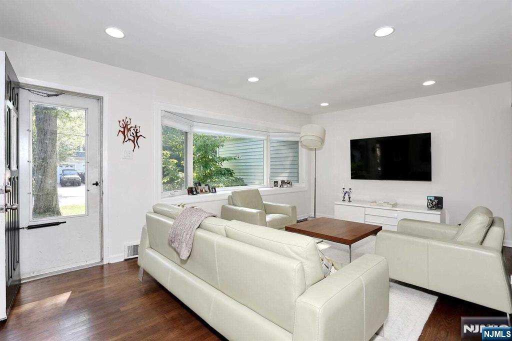 11 Evans Road Cresskill, NJ 07626 - Photo 5 of 31 a living room with furniture and a flat screen tv