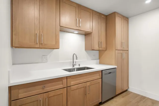 a kitchen with a sink and cabinets